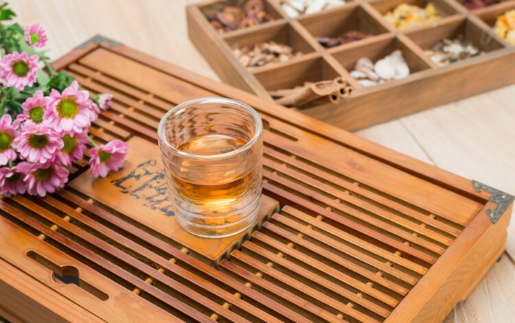 Chinese herbal medicine in box on table.