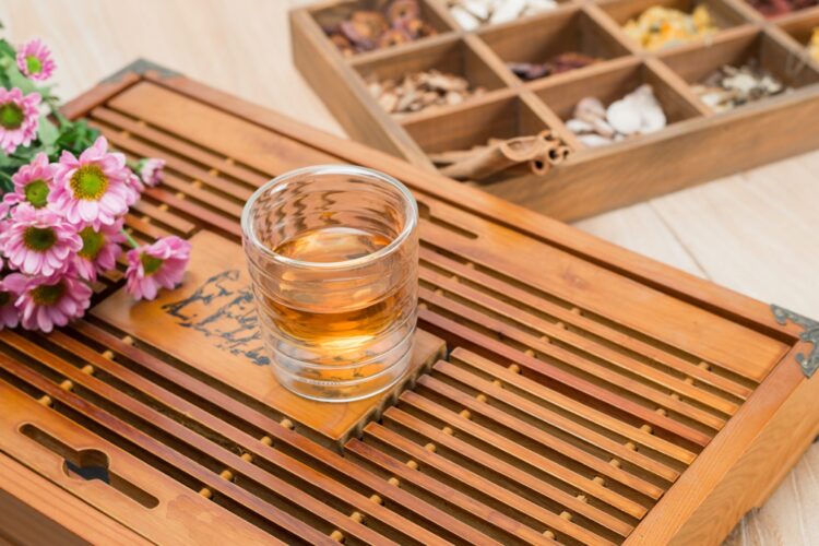 Chinese herbal medicine in box on table.